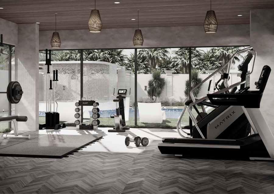 Residents gymnasium with cable machine, dumbbell rack and treadmills on a herringbone wood floor