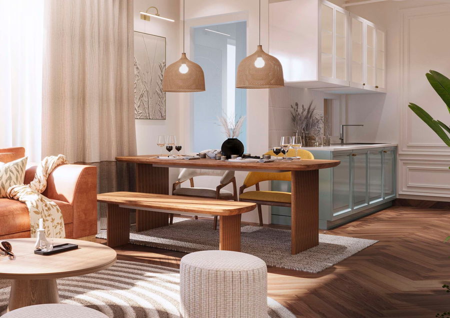 Open kitchen and dining area with a pale mint modular kitchen, wooden table and rattan pendants